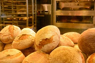 Heap of fresh-baked Czech bread in a Prague bakery